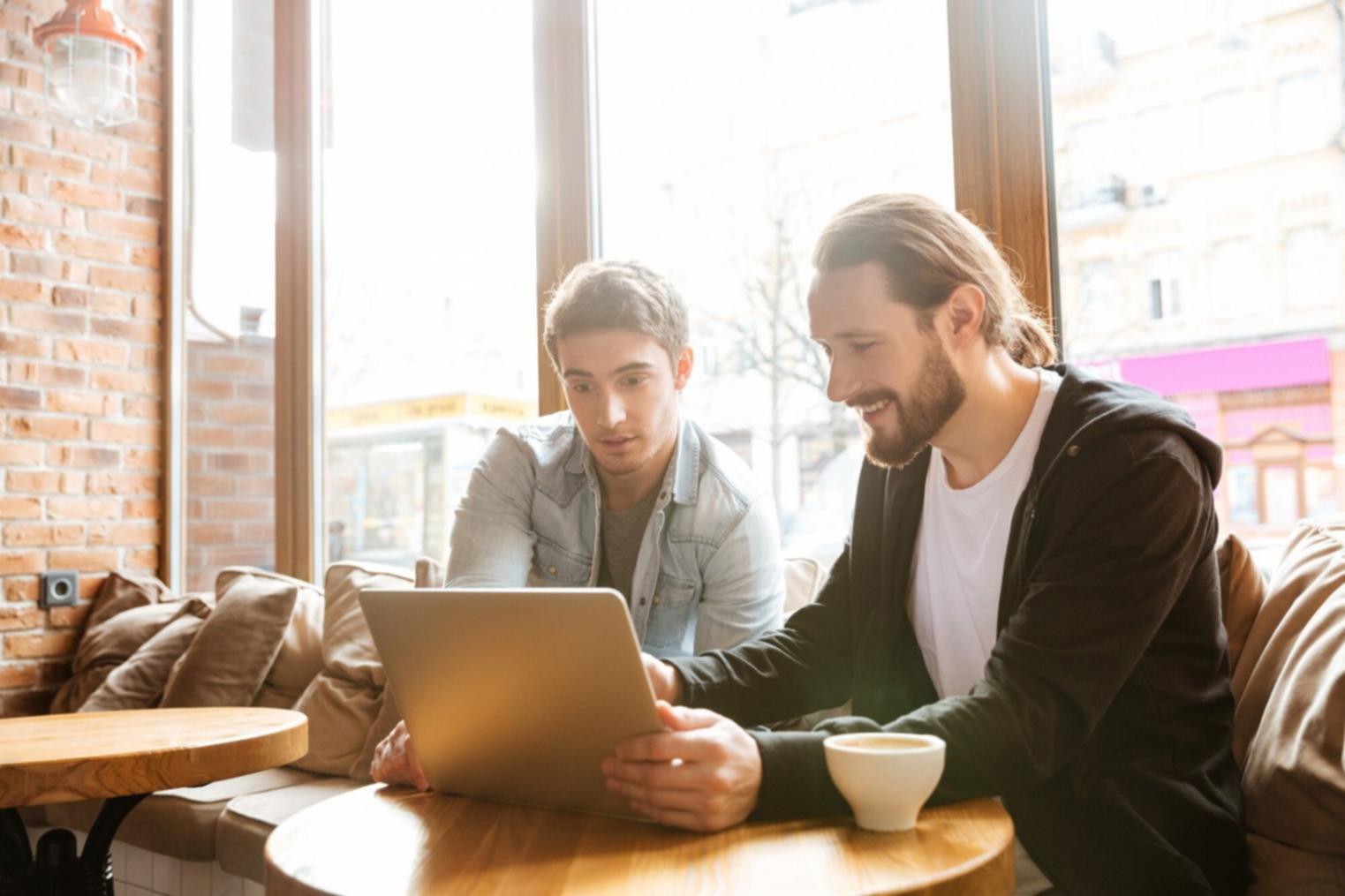 Workshop participants reviewing financial documents together